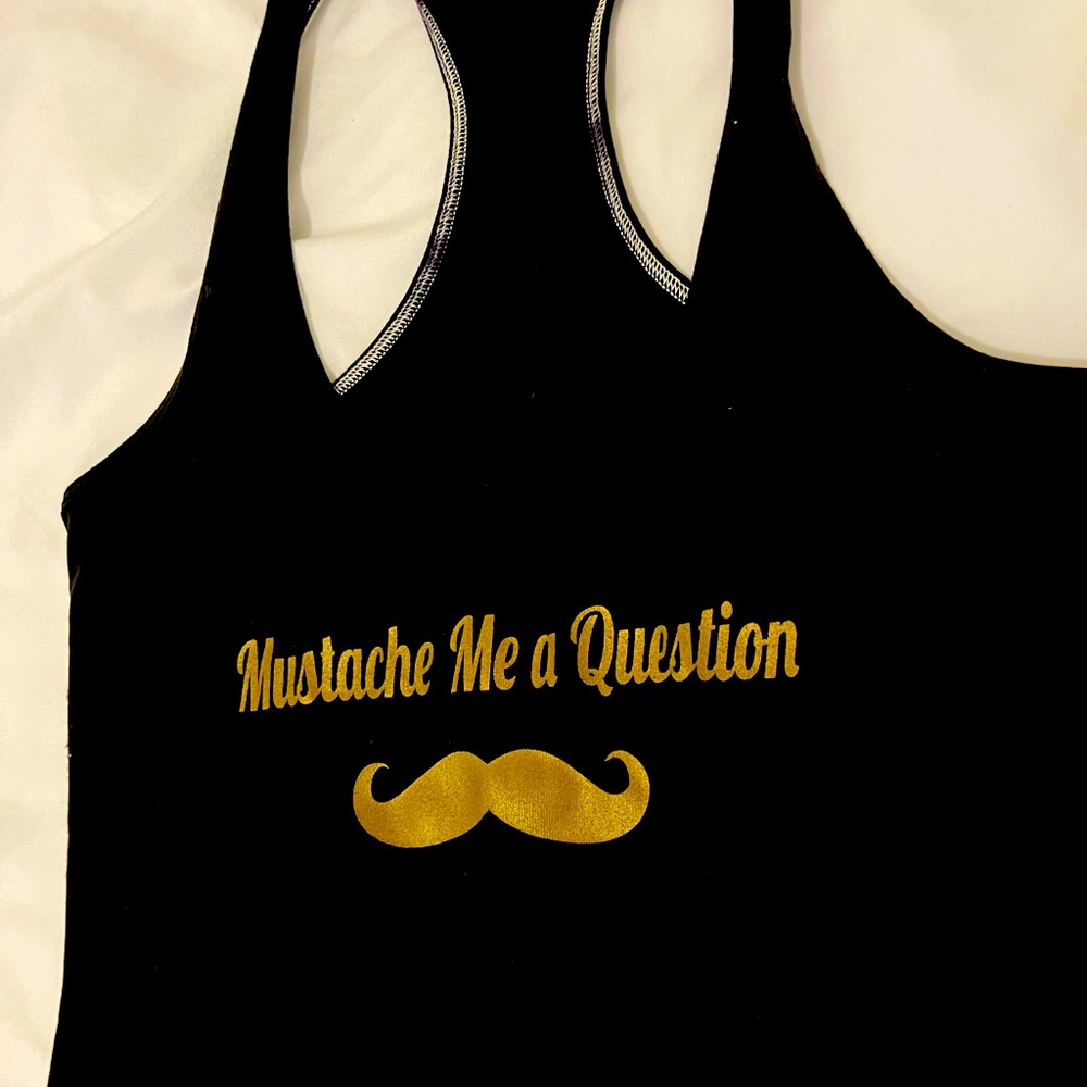 Lululemon tanktop. Rare. NWOTs. Washed only.Didn’t fit. “Mustache Me a Question”